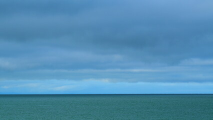Obraz premium Sea And Sky Before The Rain. Heavy Precipitation And Tropical Cyclone. Signs Of The Coming Rain. Still.