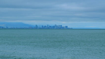 City Skyline With Marine Landscape Overcast Sea And Sky. Modern Futuristic City Located On The Surface Of The Sea. Still.