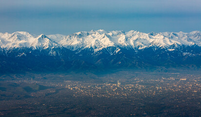 Fototapeta premium View from an airplane of Almaty, the largest city and southern capital of Kazakhstan.