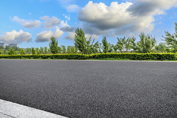 Empty asphalt road and woods natural scenery