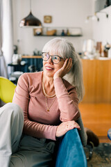 Happy senior woman relaxing at home