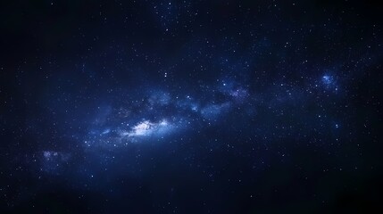 A stunning view of a galaxy filled with vibrant blue hues against a dark starry background.