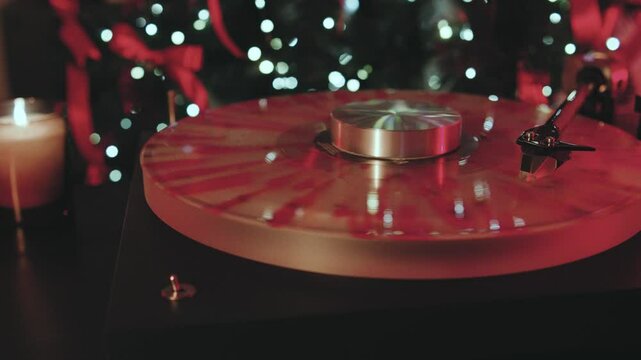 A vintage turntable showcases a collection of colorful vinyl records amid warm candlelight and twinkling lights, creating a cozy atmosphere for music lovers who appreciate the finer things