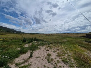 Highland Landscape with Cumulus Clouds and Grassland