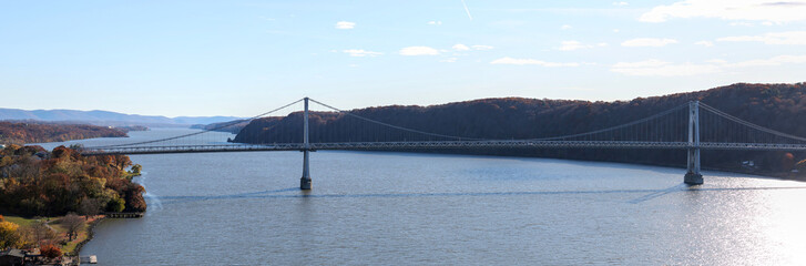 panoramic view of mid hudson bridge over hudson river valley (poughkeepsie, upstate new york) sunny day train station wide angle sun glare crossing suspension small town travel metro north