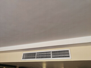 Ceiling vent is installed in a neutral-colored room, contributing to air circulation and comfort in...