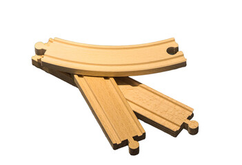model train track puzzle pieces for small trains on rails (wood toy for kids close up isolated on plain background) white yellow piece cut out children's holiday gift