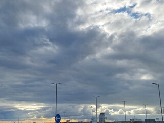 White cumulus clouds in the stormy sky