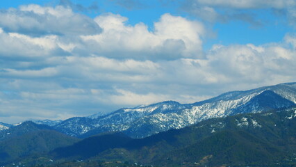 Green Forest Covers The Hills. Mountain Massif In The Sun Trees And Slopes. Timelapse.