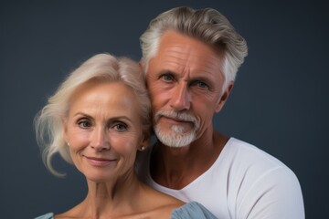 A man and a woman are posing for a picture