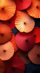 Close-up of vibrant red and orange paper parasols.