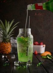 kiwi Mojito cocktail And mint , on dark background. Sugar free