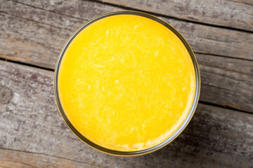 Freshly squeezed orange juice on wooden  table