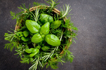 Mix of fresh herbs in wicker basket