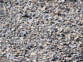 Collection of natural river stones with a rough texture and gray color