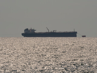 Sea freighter sailing in the middle of the ocean with big waves