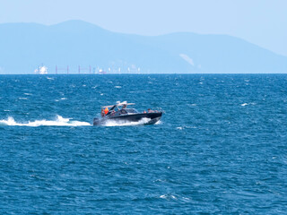 Novorossiysk, Russia 28 August 2024 Small fishing boat in the Black Sea coast in Russia Novorossiysk City