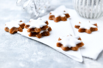 Christmas cookies (cinnamon stars) on bright background. Close up.