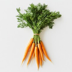 Fresh organic carrots with green tops on a white background.