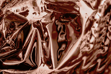 Abstract chocolate swirl with metallic reflections and rich textures