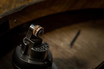 The work of jewelers. Trial jewelry of semiprecious metals. Ring. Selective focus. Macro photo.