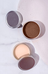 Mocha Mousse - color of the year 2025. colorful lip balms in round tin cases , mockup design