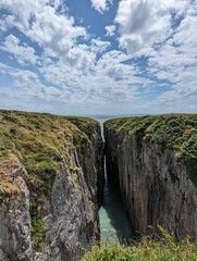 Two cliffs meeting with a gap in the middle 