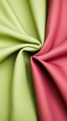 Two pieces of fabric with one being green and the other being pink