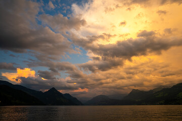 Lake in the Swiss Alps. Panoramic view of the nature and mountains of Switzerland. Mountain in the in summer, panoramic view with mountain. Alpine scenery. Mountains over the lake and the alps.