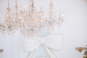 Elegant chandelier and festive decor enhancing a winter celebration atmosphere