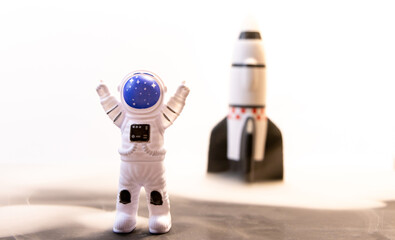 An Astronaut Celebrates With A Rocket Behind Them After A Successful Landing