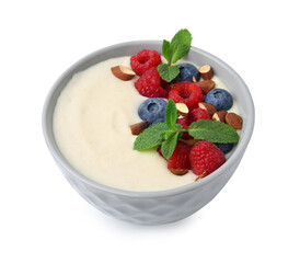 Tasty cooked semolina porridge with almonds, berries and mint isolated on white