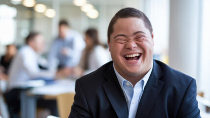Fototapeta premium A joyful East Asian male with Down syndrome smiles brightly while seated in a modern office setting, embodying positivity and approachability.