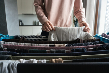 Woman Sorting Laundry