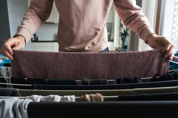 Hanging Clothes on Drying Rack