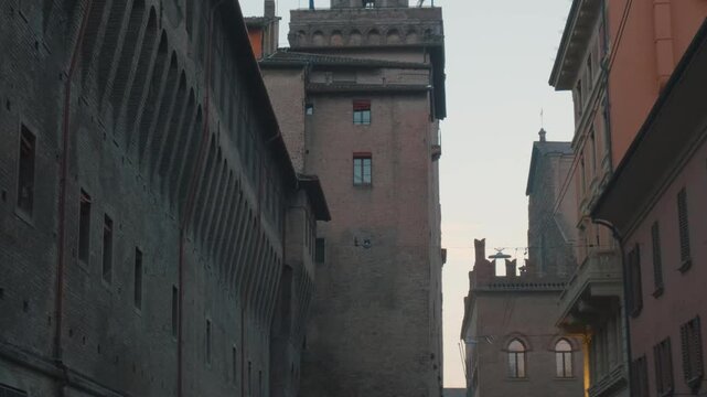 Bologna old town with Palazzo dAccursio on Piazza Maggiore, Emilia Romagna, Italy. Town Hall with big clock on tower on main city square at sunrise with nobody. Travel destination in Europe