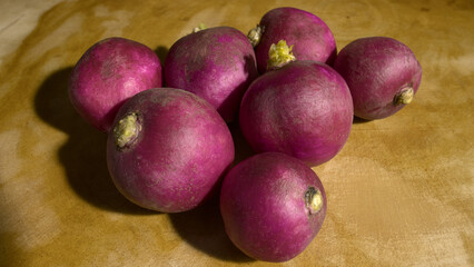 7 Fresh Red Radish on a Wooden Table 
