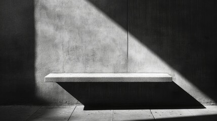 High noon light creating a stark, elongated shadow from a small ledge on a concrete wall.
