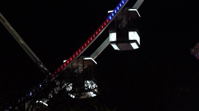Close-up shot of the Ferris wheel at night in Paris