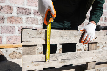 cropped view of repairman holding measuring