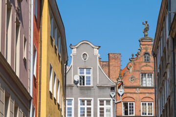 Beautiful facades of historical buildings in the Old Town. Narrow streets. Gdansk, Poland. Architecture details.