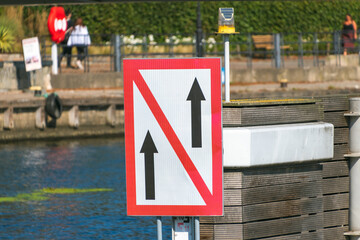 A navigation sign on an inland waterway regulates vessel traffic