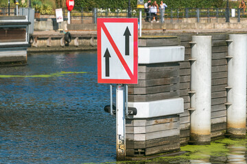 A navigation sign on an inland waterway regulates vessel traffic
