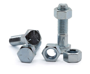 Zinc plated nuts and bolts on a plain white back ground.