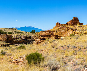 Ruins of Box Canyon Pueblo With The San Francisco Peaks in The Distance, Wupatki National Monument, Arizona, USA