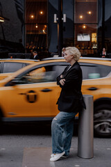 Chic Urban Style featuring a Yellow Taxi enthusiastically in Motion cityscape