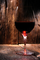 glass of wine on wooden table