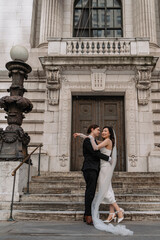 Romantic Wedding Couple Enjoying an Intimate Embrace at Beautiful Historic Venue