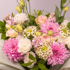 Bouquet of flowers with pink roses, chrysanthemum and freesia flower in a vase isolated on a white background.