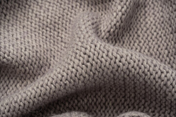 Grey wool sweater texture as a background.
